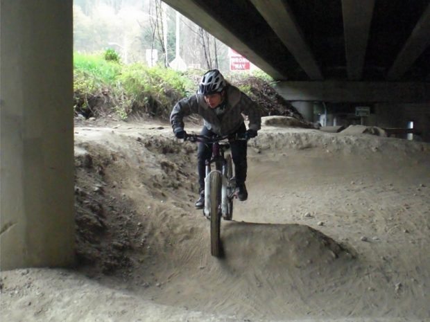 Jess riding the Colonnade Pump Track